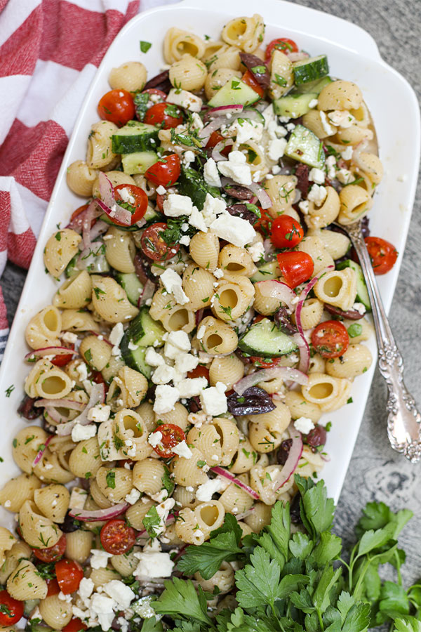 Greek pasta salad with shellbows pasta and fresh produce