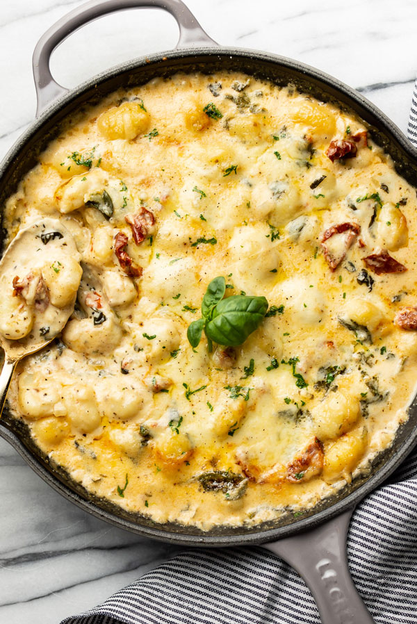 Gnocchi in a skillet in a creamy cheesy sauce