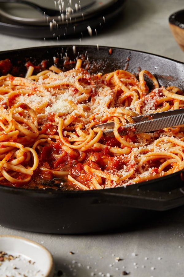 Pasta in red sauce in skillet