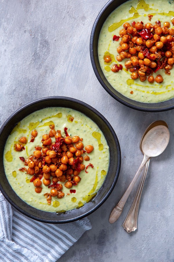 avocado soup in black bowl