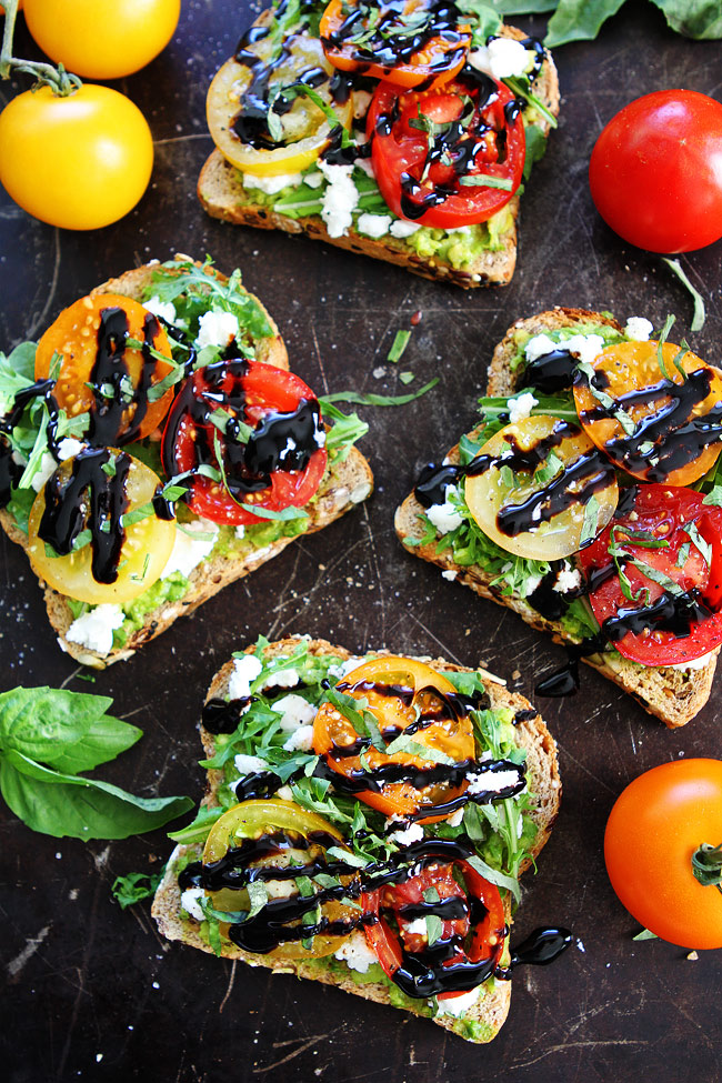 Avocado toast topped with goat cheese and tomato 