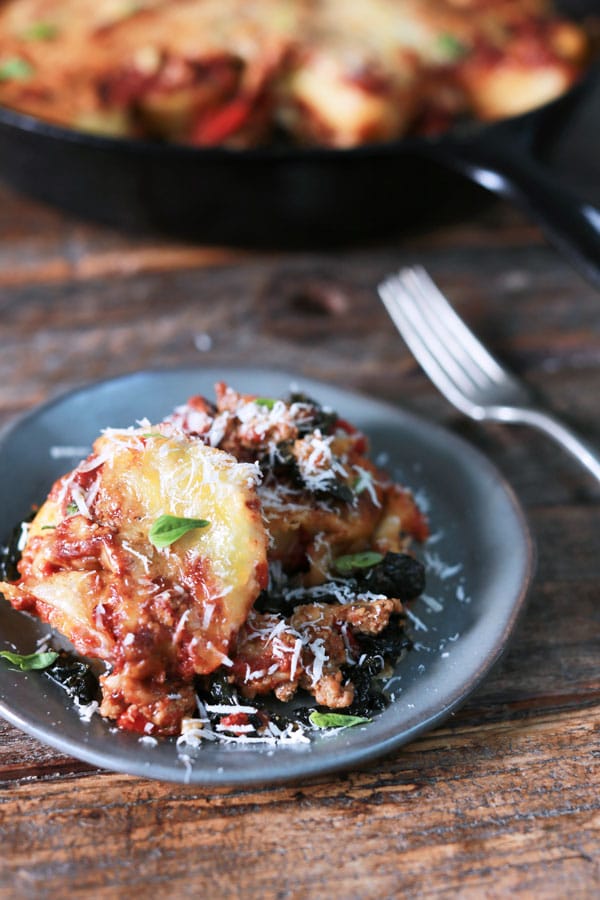 Image of Baked Polenta with kale roasted peppers and artichokes