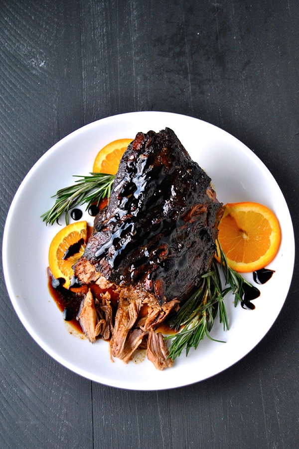 Balsamic citrus pork roast on a white plate