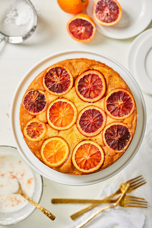 Blood Orange Polenta olive oil cake with slices of blood orange on top 