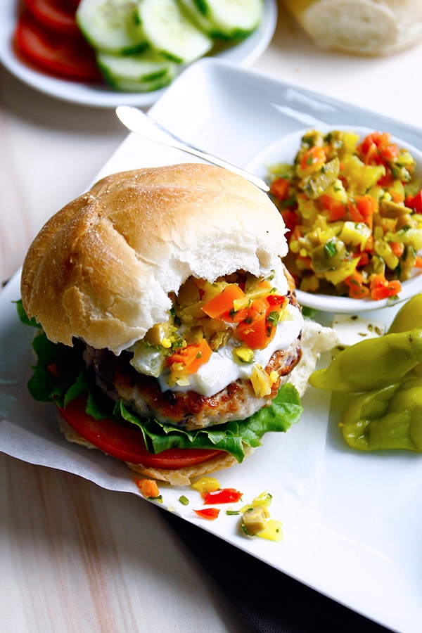 A burger being served with a homemade Giardiniera relish