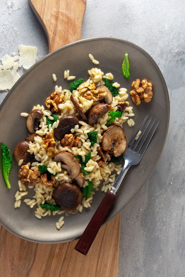 Image of Risotto with walnuts, mushrooms, and tuscan kale