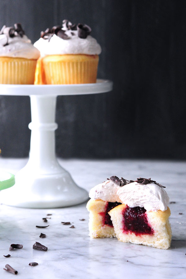 sour cherry vanilla cupcakes cut in half 