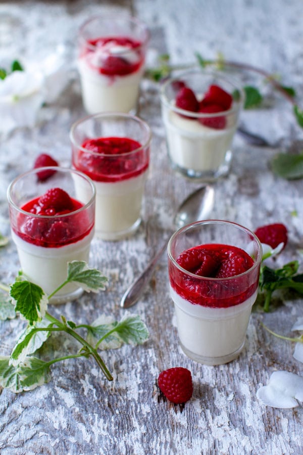 Vanilla Bean panna cotta with raspberries in a glass