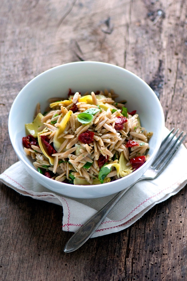 Image of whole wheat orzo pasta served in a white bowl