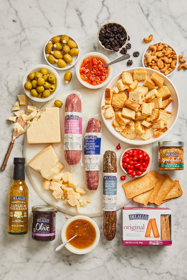 Assorted DeLallo charcuterie products arranged on a table