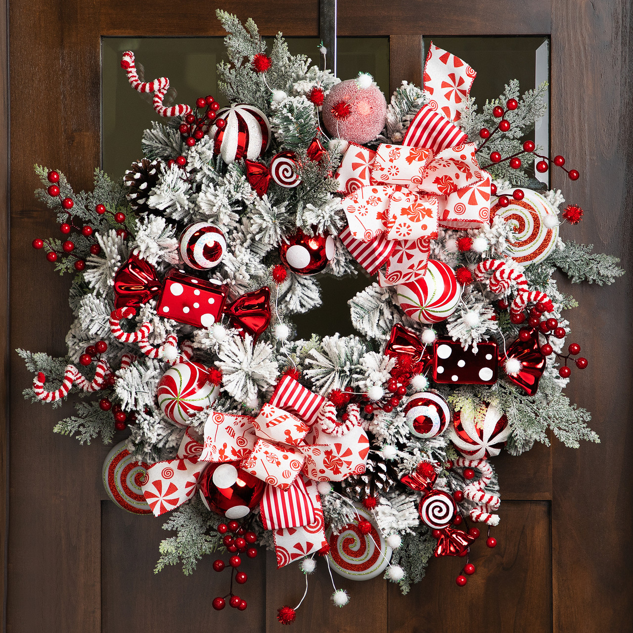 Heavily Flocked Pine with Candy Cane Striped Ornaments Christmas