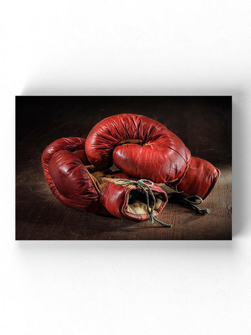 Old Red Boxing Gloves Wrapped Canvas -Image by Shutterstock