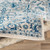 7.8' x 10.25' Beige and Peacock Blue Distressed Finished Rectangular Area Throw Rug