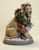 19.25" Beige and Gray Lion with Lamb 'Peace on Earth' Christmas Tabletop Figurine
