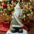 18.5" Brown and White Santa Holding Christmas Tree Tabletop Figurine