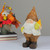 12.25" Brown and White Gnome Holding a Half Peeled Stalk of Corn Christmas Decor