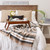 4' x 5' Black, Brown, and White Striped Rectangular Woven Throw