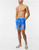 ASOS DESIGN swim shorts in clear blue with brief inner mid length