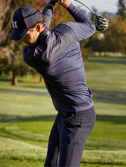 Man wearing Cutter and Buck apparel while playing Golf