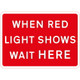 1050 x 750mm When Red Light Shows Wait Here - 300mm Centres Black Plastic Sign