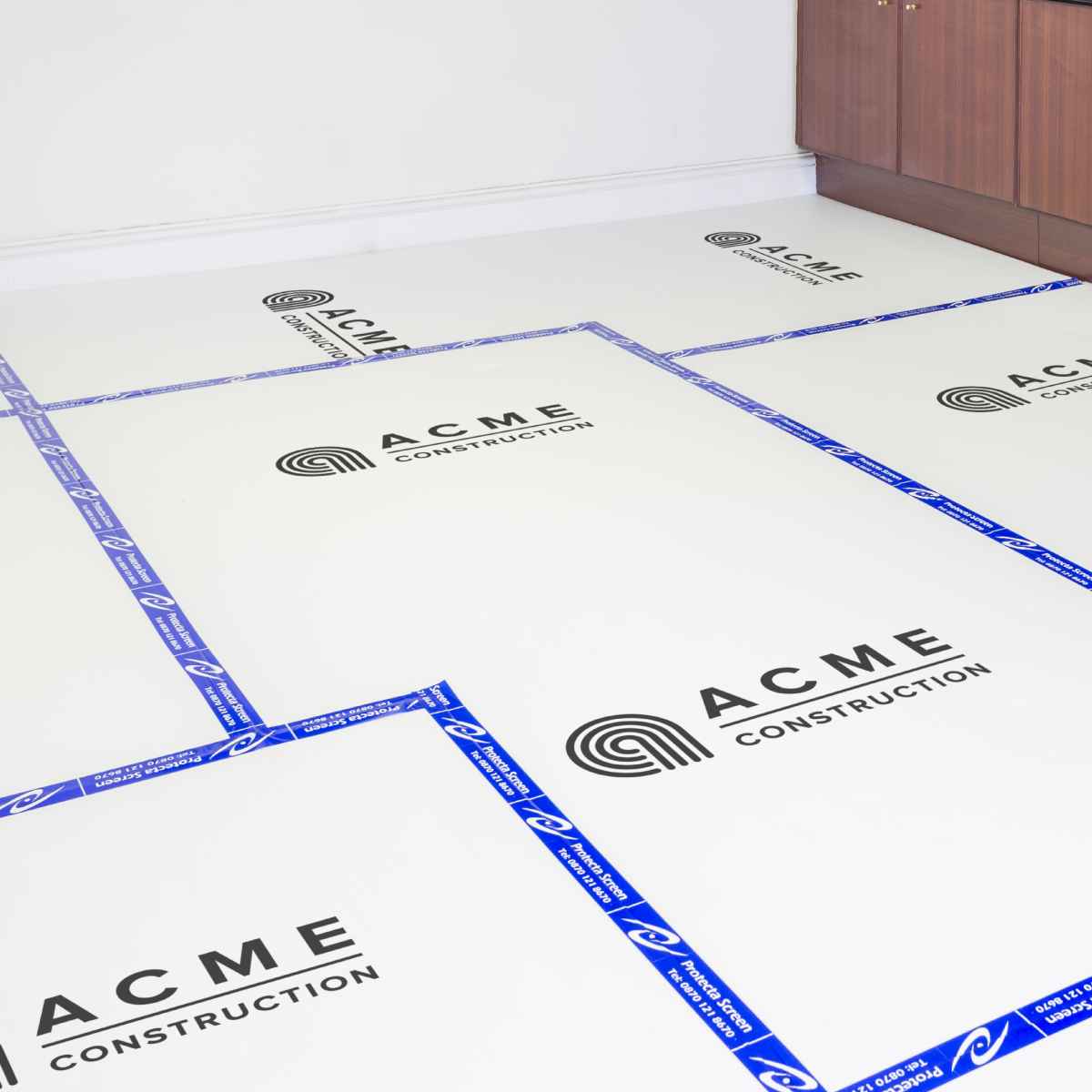 White fluted protection board custom printed with a customer logo, laid on a site floor