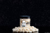 A cup of Candy Club's Star Wars Stormtrooper cup on a pile of sour candy.
© & ™ Lucasfilm Ltd.