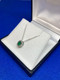 9ct White Gold Oval Emerald & Diamond Pendant