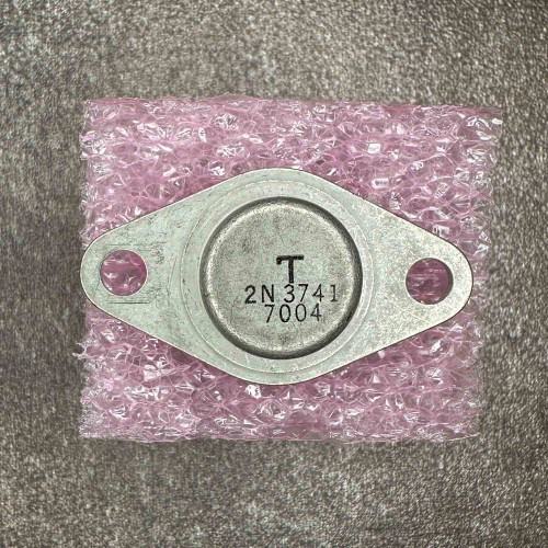 2N3741 PNP power transistor in a TO-66 metal case showing the stamped model number and mounting holes.