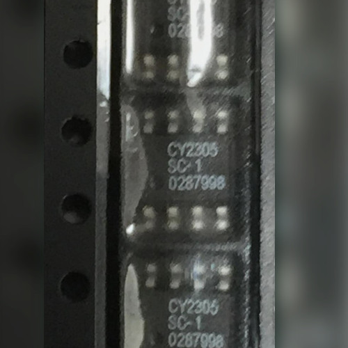 Three 8-pin SOIC chips in a row, two legibly marked CY2305 SC-1, close view