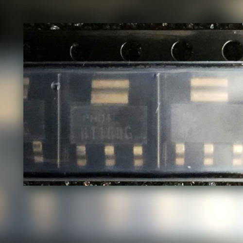 Row of black plastic surface-mount parts, each with three narrow leads and one wide tab