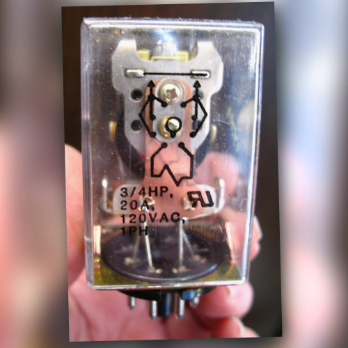 Potter & Brumfield KRPA14AG-24V 3PDT relay held in hand, clear cover showing schematic and 3/4HP 20A 120VAC marking