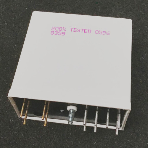 Underside of white Opto 22 module showing two rows of pins and captive screw