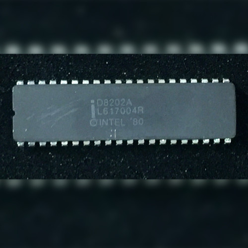Intel D8202A grey ceramic 40-pin DIP on a dark speckled surface, marking upright, notch left