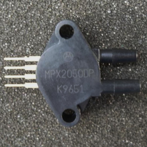 Motorola MPX2050DP pressure sensor with two side-by-side ports and four leads