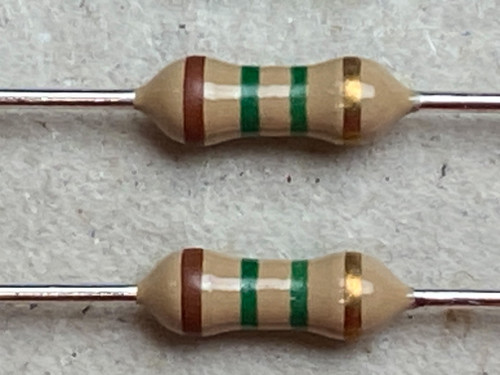 Two carbon film resistors, color bands Brown, Green, Green, Gold. Leads appear clean, no visible oxidation or damage.
