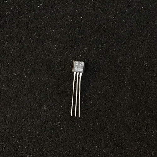 Transistor body showing "S 2N 5086" markings, leads are clean and straight with no visible corrosion.
