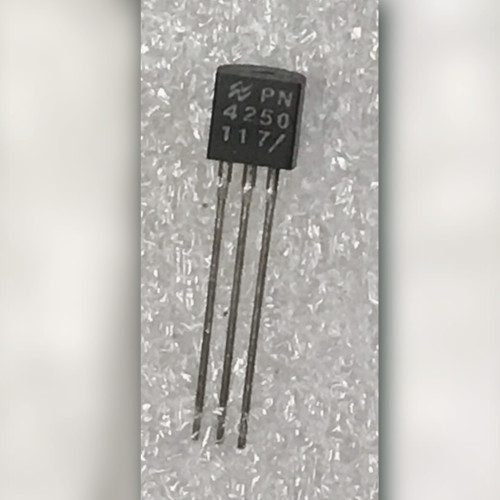 National Semiconductor PN4250 PNP transistor held in fingers, TO-92 markings and script N logo visible