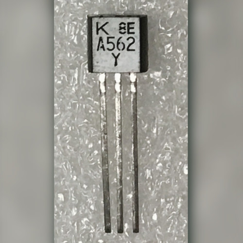 Toshiba A562 Y PNP transistor on textured plastic sheet, leads straight and untrimmed