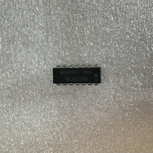 IC chip marked "MALAYSIA 340A" and "LM339N" with TI logo, pins straight and untarnished, no visible damage.