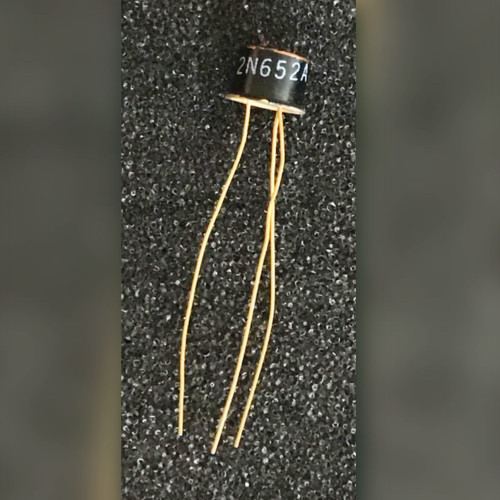Motorola 2N652A germanium transistor on black foam with three long gold colored leads
