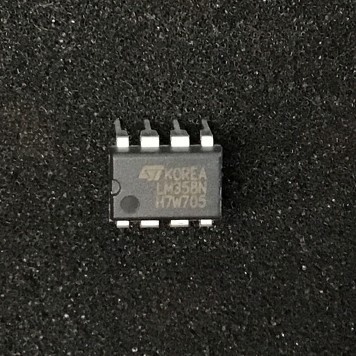 DIP-8 plastic package marked "ST KOREA / LM358N / H7W705" on upper face; all eight leads present, no visible damage.