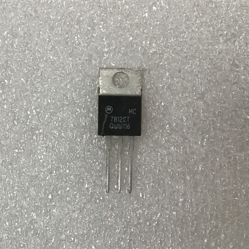 Motorola logo, "MC", "7812CT", "QWw116" visible on body. Leads straight, clean, no visible corrosion. Metal tab clean.