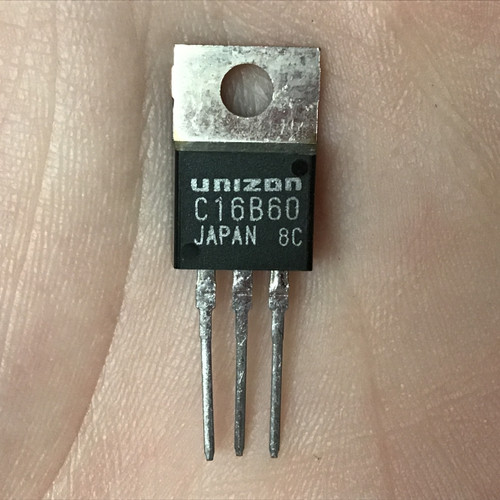 Unizon C16B60 N-Channel Power MOSFET in a TO-220AB package held in a hand, showing the label.