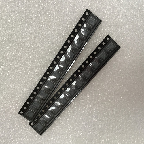 Two strips of SOIC-8 linear regulators in intact tape and reel packaging, showing no visible damage or signs of use.