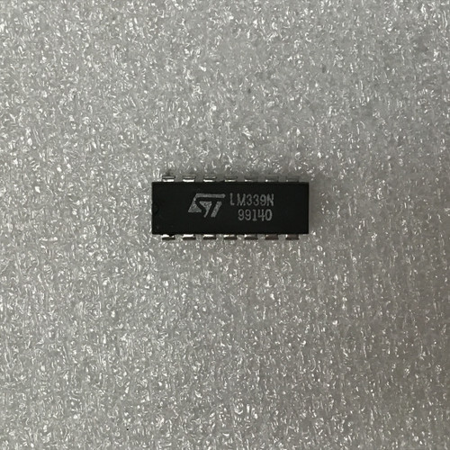 STMicroelectronics LM339N DIP-14 IC showing clear markings, straight pins, no visible damage.