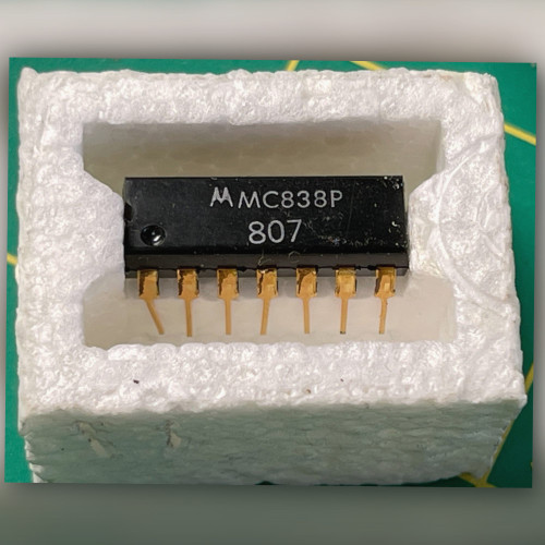 Single Motorola MC838P decade counter with bright gold leads in open white foam carrier
