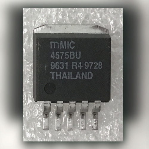 Micrel MIC4575BU marked 4575BU 9631 R4 9728 THAILAND on a light crinkled surface
