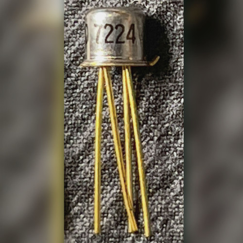 Motorola metal can JFET on gray background, gold leads left, can marking ending in 224