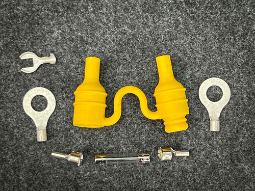 Bussmann HFB yellow fuse holder disassembled with two ring lugs, fork lug, contacts, glass fuse