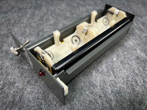 Allen Bradley 1772-B1 battery holder with red LED indicator and battery contacts visible.